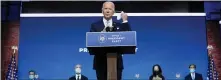  ?? CAROLYN KASTER — THE ASSOCIATED PRESS ?? President-elect Joe Biden removes his face mask as he arrives to introduce his nominees and appointees to key national security and foreign policy posts at The Queen theater on Tuesday in Wilmington, Del.