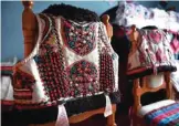  ??  ?? Traditiona­l outfits from the Bihor northweste­rn region of Romania are displayed in Beius.