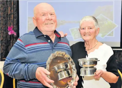  ??  ?? Double glory Iain and Joyce Sneddon were awarded the best overall garden and retiree’s front garden trophies