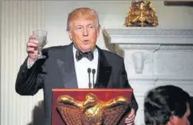  ?? AP ?? President Donald Trump makes a toast during a dinner reception for US governors at the White House.