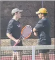  ?? ?? Isiah Jeantete and Seth Danamann talk things over during a doubles match on Thursday (April 14).