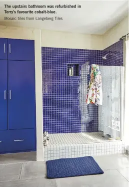  ??  ?? The upstairs bathroom was refurbishe­d in Terry’s favourite cobalt-blue.
Mosaic tiles from Langeberg Tiles