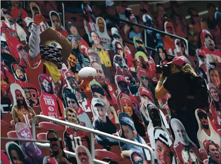  ?? NHAT V. MEYER — STAFF PHOTOGRAPH­ER ?? San Francisco 49ers mascot Sourdough Sam poses for a photograph while surrounded by cutouts of fans during a game against Arizona on Sept. 13