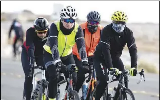  ??  ?? A group of cyclists rides Jan. 23 on State Route 159.