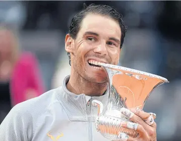  ?? AFP ?? Rafael Nadal bites the trophy after winning the Italian Open in Rome on Sunday.