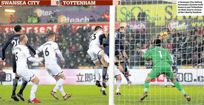  ??  ?? > Swansea City old boy Fernando Llorente nods home to put Tottenham on their way to victory at the Liberty Stadium