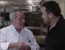  ?? PHOTOS COURTESY OF NETFLIX ?? Celebrity chef Wolfgang Puck, left, and James Beard Award-winning chef David Chang in Chang’s docuseries “Ugly Delicious” on Netflix. Over eight episodes, David travels the world with writers and chefs, activists and artists, who use food as a vehicle...