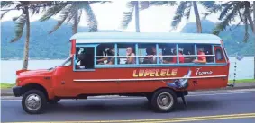  ?? TNS ?? Public transporta­tion on the American Samoa island of Tutuila is handled by privately owned “aiga” or family buses, often with colorful custom paint jobs.