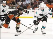  ?? CHRIS CARLSON — ASSOCIATED PRESS ?? Sharks winger Jannik Hansen, right, battles Ducks defenseman Cam Fowler in the first period Thursday.