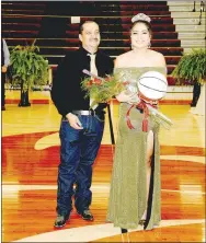  ?? PHOTO COURTESY OF LIFETOUCH NATIONAL STUDIOS ?? Lincoln senior Nadia Ortiz escorted by her father, Julian Ortiz, won the 2021 Colors Day queen crown during ceremonies held at Wolfpack Arena on Friday.