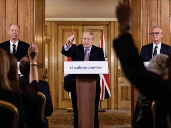  ?? (Getty) ?? Chris Whitty, Boris Johnson and Patrick Vallance delivering a press conference on coronaviru­s at the start of the pandemic