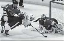  ?? The Associated Press ?? Florida Panthers Mike Matheson and goalie Roberto Luongo defend against Toronto Maple Leafs’ Zach Hyman on Wednesday in Sunrise, Fla. The Panthers won 2-1 in a shootout.