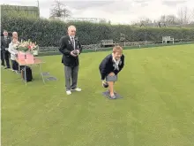  ??  ?? First throw President Ian Skillen looks on as secretary Ann Phillips opens the green at Cambuslang last week