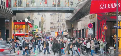  ?? JACQUES BRINON/The Associated Press ?? Head to the top of the French department store Galeries Lafayette in Paris to see a vista of the city’s rooftops from its patio.