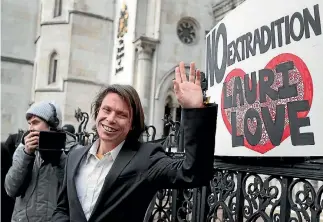  ?? PHOTO: AP ?? Lauri Love waves to his supporters outside the Royal Courts of Justice in London after his successful appeal against extraditio­n to the United States.