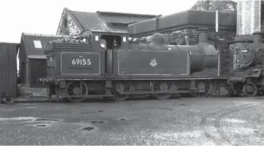  ?? K A Gray, courtesy B McCartney ?? For many years Canal shed had a number of ‘N15’ 0-6-2Ts for shunting duties, largely in the yards at Canal Basin. However, this circa 1961 view records No 69155 at the rear of the roundhouse. Originally NBR ‘386’ class No 918 of August 1912 (NBL Works No 19839), it arrived in November 1940 as LNER No 9918, and latterly was a favourite for Canal’s London Road pilot duty until it left service on 3 September 1962 as the last of its type, by several years, to work from the shed; its disposal was at Cowlairs. Of note is that the ‘N15’ still carries the pre-1956 British Railways logo, the BR Standard ‘2MT’ 2-6-0 also on hand, No 78046, is visiting from Hawick, and across the rails behind the 0-6-2T is a wooden plank carrying a pair of (red?) lamps, apparently barring access to the nearby wheel drop.