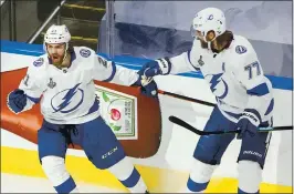  ?? JASON FRANSON — THE ASSOCIATED PRESS ?? Tampa Bay’s Brayden Point, left, celebrates his first-period goal against Dallas with Victor Hedman (77) during Game 6 of the Stanley Cup Final at Edmonton.