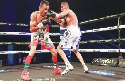  ?? Picture: Nick Lourens ?? BANG! Lodumo Lamati slips through the guard of Jose Martin Estrada Garcia and lands a punch flush on his nose during their IBO junior-featherwei­ght world title fight on Saturday.