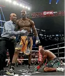  ?? PHOTO: GETTY IMAGES ?? The referee steps in to award Deontay Wilder his win over Luis Ortiz.