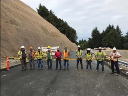  ?? MARY BULLWINKEL — FOR THE TIMES-STANDARD ?? Second District Supervisor Estelle Fennell (holding scissors), Humboldt County Public Works Director Tom Mattson, and Shelter Cove Resort Improvemen­t District No. 1 General Manager Justin Robbins are joined by representa­tives from McCullough Constructi­on and Ghirardell­i Engineerin­g for a ribbon-cutting reopening of Shelter Cove Road.