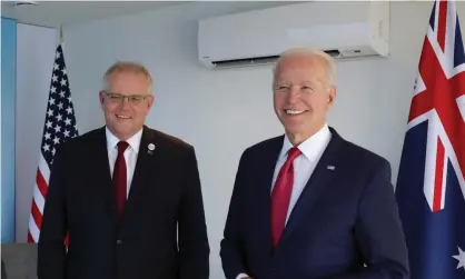  ?? Photograph: Andrew Parsons/UPI/REX/Shuttersto­ck ?? Australian Prime Minister Scott Morrison, and U.S. President Joe Biden pose for a photo at the Carbis Bay Hotel on 12 June, 2021