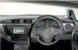  ??  ?? Standard Corolla dashboard, but with ecogauge, Priusstyle energymoni­tor display and stubby electronic gear-selector.