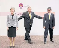  ??  ?? US Secretary of State Mike Pompeo attempts to get his Japanese counterpar­t Taro Kono and South Korean counterpar­t Kang Kyung-wha to pose after a meeting on the sidelines of the Asean Regional Forum in Bangkok on Aug 2.