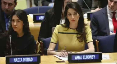  ?? BEBETO MATTHEWS/THE ASSOCIATED PRESS ?? Human rights lawyer Amal Clooney and her client Nadia Murad, a human rights activist and Yazidi genocide survivor, at a UN conference earlier this month. Daesh extremists murdered Murad’s mother and six brothers in northern Iraq in 2014.