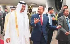  ?? WAM ?? Shaikh Mohammad Bin Zayed with Ethiopia’s prime minister following his arrival in Addis Ababa on an official visit.