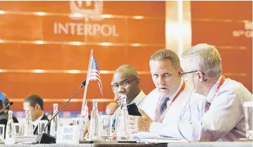  ??  ?? US delegates attend the 86th Interpol General Assembly at Beijing National Convention Centre in Beijing, China. — Reuters photo