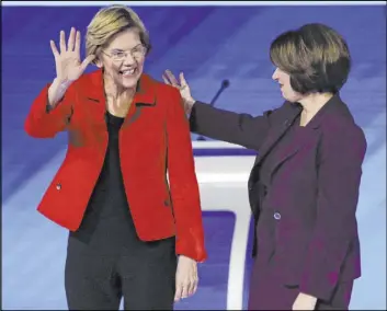  ?? Charles Krupa The Associated Press file ?? Sen. Elizabeth Warren, D-Mass., left, and Sen. Amy Klobuchar, D-Minn., have the most traction among the remaining female Democratic presidenti­al candidates.