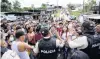  ?? PHOTO: REUTERS ?? Relatives of inmates gather outside the Santo Domingo de los Tsachilas prison in Ecuador after authoritie­s reported they had quelled a riot there.