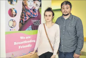  ?? NIKKI SULLIVAN/CAPE BRETON POST ?? Nicole Fraser and her husband, James Fraser, stand beside a sign, located close to the main entrance, that indicates the Cape Breton Regional Hospital is a breastfeed­ing friendly environmen­t. On Friday, Nicole was videotaped by a stranger while...