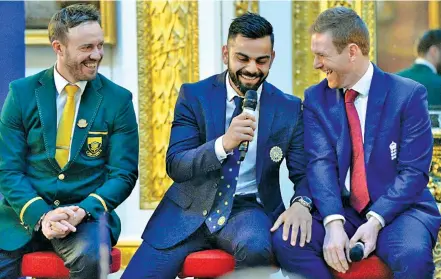  ?? — ICC ?? AB de Villiers (SA, from left), Virat Kohli and Eoin Morgan (England) share a light moment at the Champions Trophy dinner.