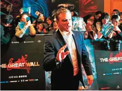  ??  ?? Actor Matt Damon gestures in front of Chinese fans as he arrives at a red carpet event for the movie ‘The Great Wall’ at a hotel in Beijing, yesterday. — AP
