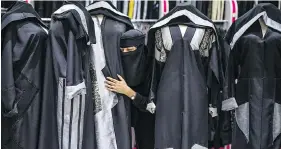  ??  ?? Pops of colour on black abayas are becoming more common in Saudi Arabia.