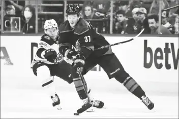  ?? KARL B DEBLAKER/AP ?? CAROLINA HURRICANES’ ANDREI SVECHNIKOV (37) battles for the puck with Boston Bruins’ Erik Haula (56) during the first period of Game 7 of a Stanley Cup first-round playoff series in Raleigh, N.C., on Saturday.