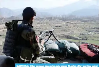  ??  ?? NANGARHAR: An Afghan commando keeps watch during ongoing US-Afghan military operations against Islamic State militants in Achin district of Nangarhar province. —AFP