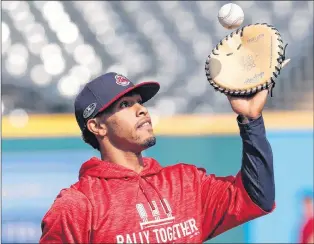  ?? AP PHOTO ?? Cleveland Indians’ Francisco Lindor catches a ball during a team workout Wednesday in Cleveland.