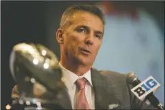  ?? The Associated Press ?? EQUAL FOOTING: Ohio State NCAA college football head coach Urban Meyer speaks at Big Ten Media Day in Chicago Monday. Meyer said that he believed the Big Ten is as strong as the SEC.