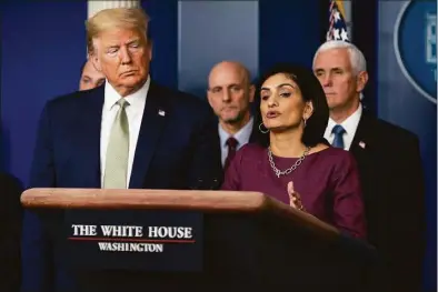  ?? Evan Vucci / Associated Press ?? President Donald Trump listens as Administra­tor of the Centers for Medicare and Medicaid Services Seema Verma speaks during a press briefing with the coronaviru­s task force, at the White House in March 2020. The Trump administra­tion cut off Medicaid coverage for some disabled people on the day after the 2020 election.