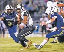  ?? STAFF PHOTO BY ROBIN RUDD ?? Bradley Central quarterbac­k Javin Burke (3) scrambles to pick up a first down during a game at Soddy-Daisy last Oct. 24. Burke said he expects to play cornerback in college.