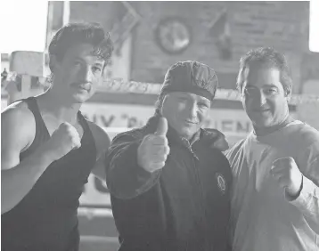  ?? SEACIA PAVAO, OPEN ROAD FILMS, VIA AP ?? Miles Teller, left, portrays boxer Vinny Paz, center, in “Bleed For This.” The movie, which was produced by Chad Verdi, right, centers on Paz’s recovery from a car accident.