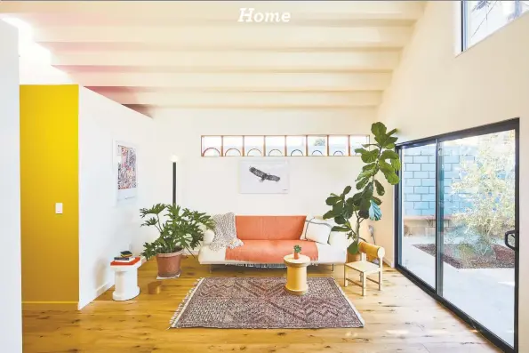  ?? Bunch Designs via Associated Press ?? A converted garage project by Bunch Design in Los Angeles employs long clerestory windows placed high on the walls of a small living room. Afternoon light streams through a westfacing skylight and a stepped ceiling creates more interestin­g light plays.