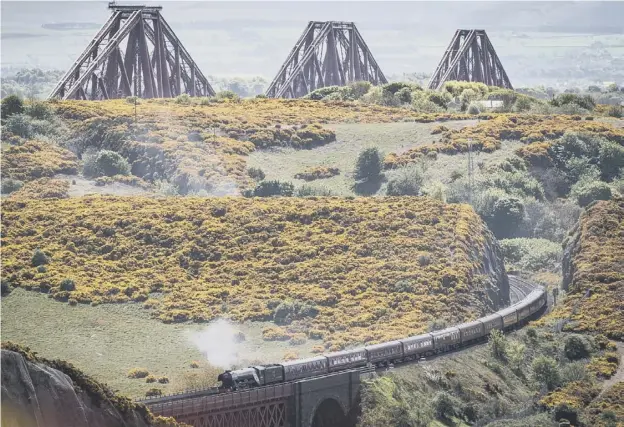  ??  ?? 0 Organisers of the Flying Scotsman trips said crossing the Forth Bridge was a major draw for steam fans booking seats to travel behind the historic locomotive