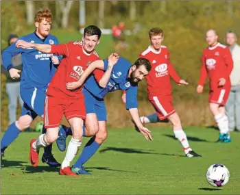  ??  ?? Craig MacEwan and Rutherglen centre half Kevin McBride battle for the ball.