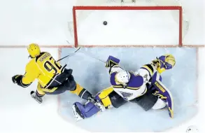  ?? MARK HUMPHREY/THE ASSOCIATED PRESS ?? Nashville Predators’ centre Ryan Johansen scores the game-winning goal against St. Louis Blues’ goalie Jake Allen during the third period in Game 6 of a second-round NHL hockey playoff series, on Sunday, in Nashville, Tenn.