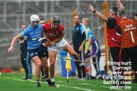  ??  ?? Flying hurl: Darragh Power and Cork’s Shane Barrett clash yesterday