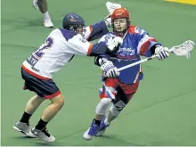 ?? CLIFFORD SKARSTEDT/EXAMINER FILES ?? Peterborou­gh Century 21 Lakers' Turner Evans eludes a high stick from Oakville Rock's Jason Noble during Major Series Lacrosse action on June 22at the Memorial Centre. Evans could miss much of the NLL season with the Toronto Rock while he recuperate­s...