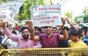  ?? PTI ?? ■ CBSE students protest over the alleged paper leak, at Jantar Mantar in New Delhi yesterday. The CBSE has scrapped the Class 12 economics exam and Class 10 mathematic­s exam.
